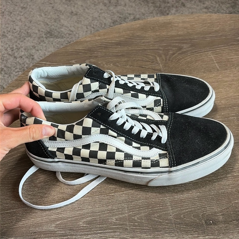 Black and white checkered Vans low top. Size 10.5.